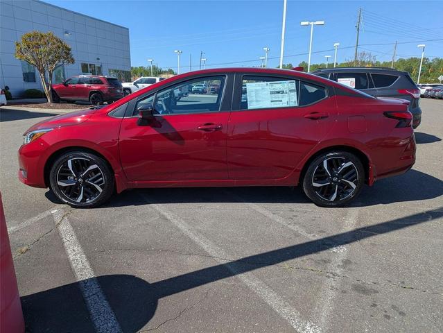 Photo of 2025 Scarlet Ember Tintcoat Nissan Versa