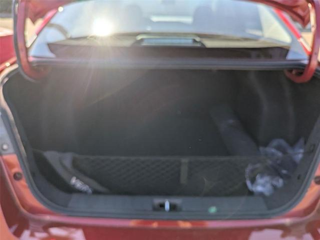 Photo of 2025 Scarlet Ember Tintcoat Nissan Versa