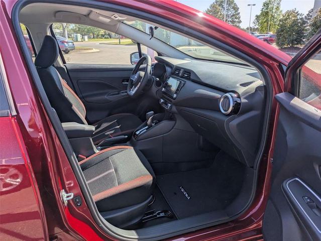 Photo of 2025 Scarlet Ember Tintcoat Nissan Versa