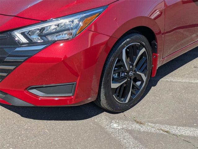 Photo of 2025 Scarlet Ember Tintcoat Nissan Versa