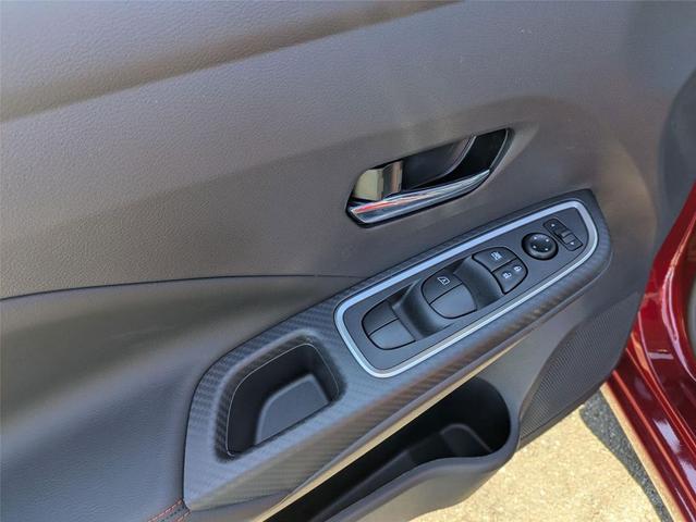 Photo of 2025 Scarlet Ember Tintcoat Nissan Versa