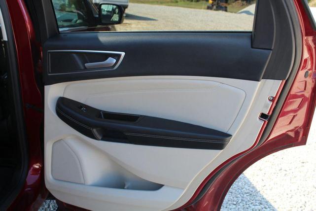 Photo of 2016 Ruby Red Metallic Tinted Clearcoat Ford Edge