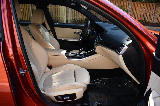 Photo of 2022 Sunset Orange Metallic BMW 330