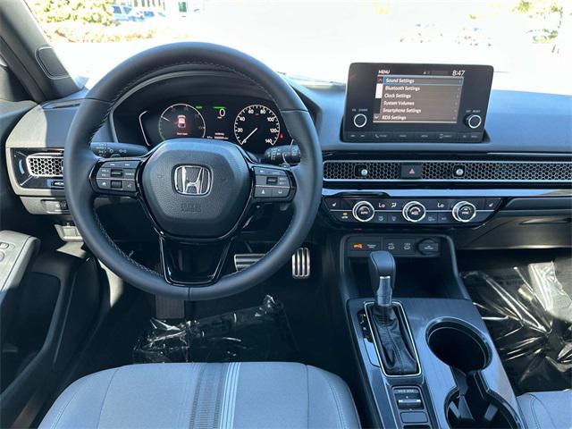 Photo of 2025 Platinum White Honda Civic Hybrid