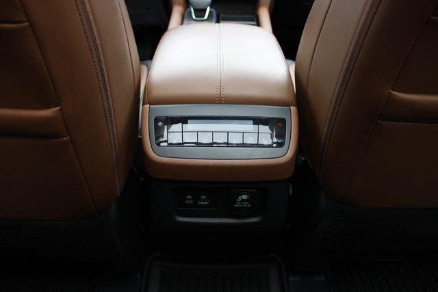 Photo of 2023 Baja Storm/Super Black Roof Nissan Pathfinder