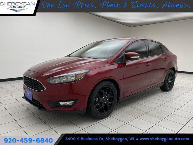 Photo of 2016 RUBY RED TINTED CLEARCOAT Ford Focus