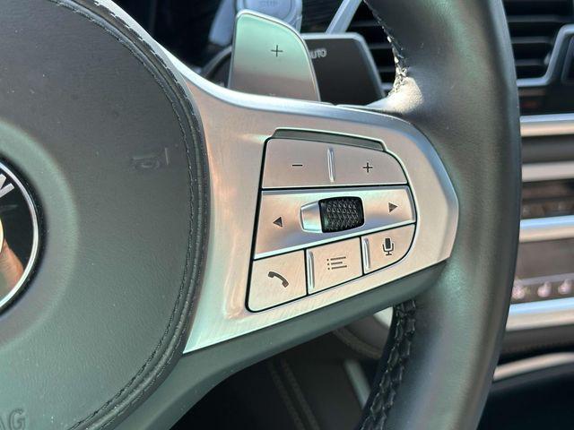 Photo of 2022 Carbon Black Metallic BMW 740