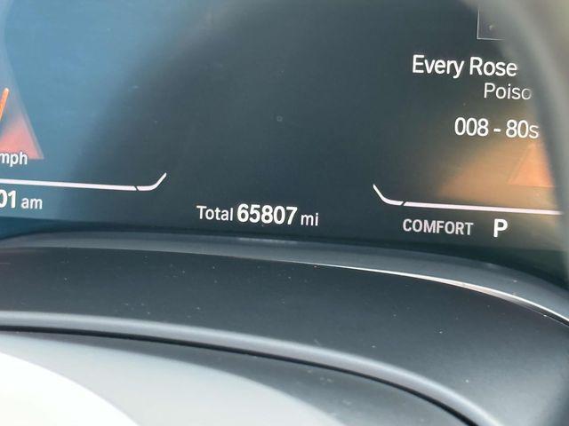 Photo of 2022 Carbon Black Metallic BMW 740
