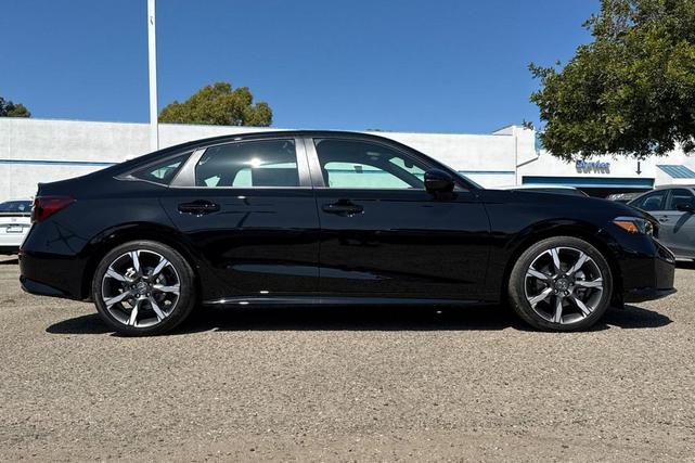 Photo of 2025 Boost Blue Pearl Honda Civic Hybrid