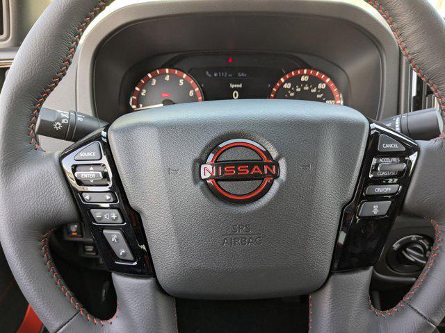 Photo of 2025 Cardinal Red Metallic Tricoat Nissan Frontier