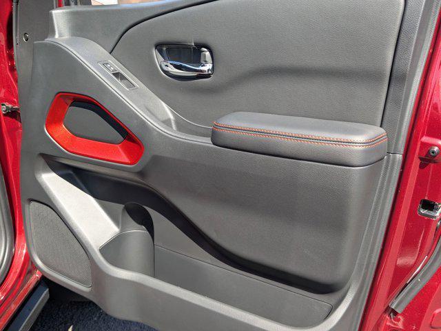 Photo of 2025 Cardinal Red Metallic Tricoat Nissan Frontier