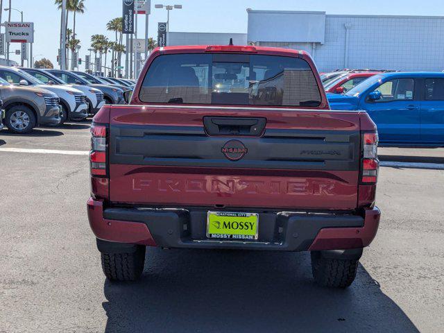 Photo of 2025 Cardinal Red Metallic Tricoat Nissan Frontier