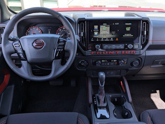 Photo of 2025 Cardinal Red Metallic Tricoat Nissan Frontier