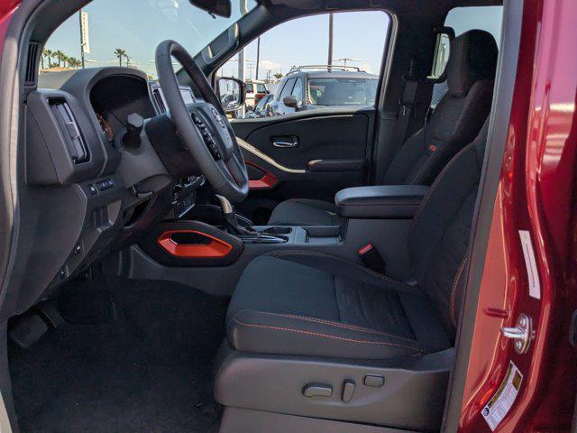 Photo of 2025 Cardinal Red Metallic Tricoat Nissan Frontier