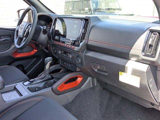 Photo of 2025 Cardinal Red Metallic Tricoat Nissan Frontier