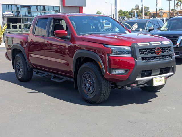 Photo of 2025 Cardinal Red Metallic Tricoat Nissan Frontier