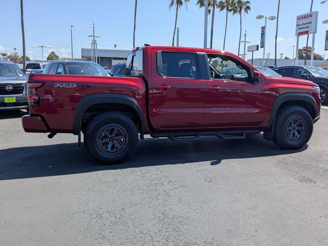Photo of 2025 Cardinal Red Metallic Tricoat Nissan Frontier