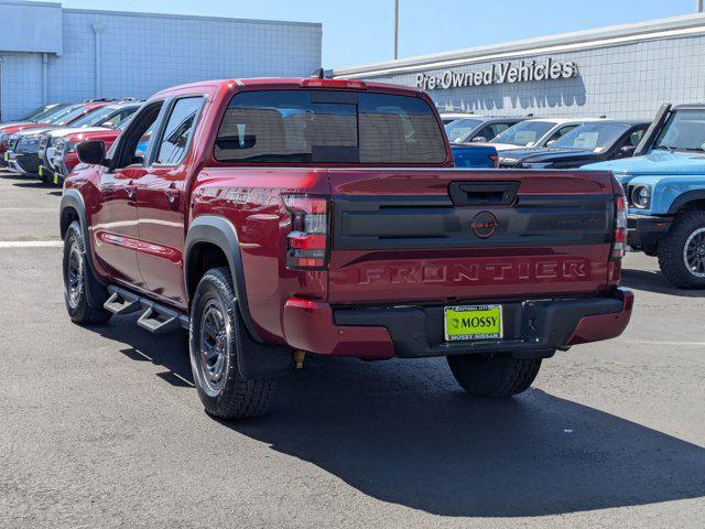 Photo of 2025 Cardinal Red Metallic Tricoat Nissan Frontier