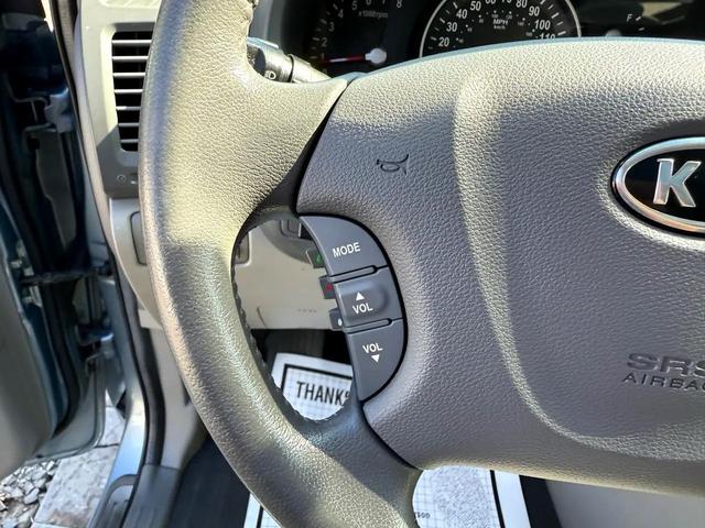 Photo of 2012 Glacier Blue Kia Sedona