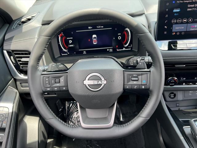 Photo of 2025 Baja Storm Metallic/Super Black Nissan Rogue
