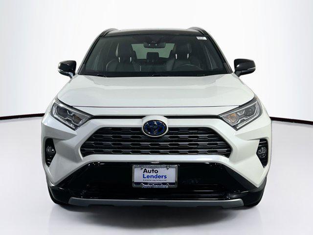 Photo of 2021 Blizzard Pearl/Midnight Black Metallic Toyota RAV4 Hybrid