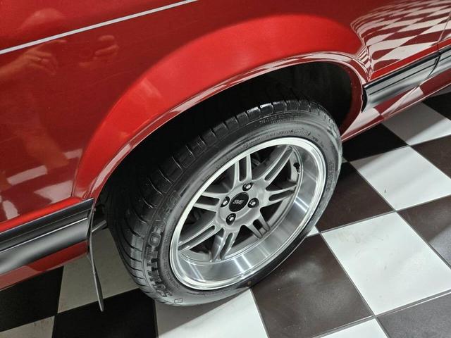 Photo of 1990 Red Ford Mustang