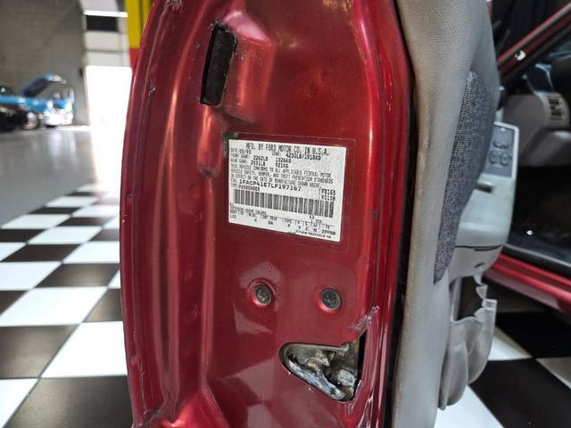 Photo of 1990 Red Ford Mustang
