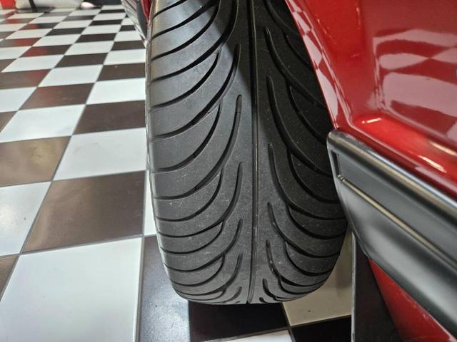 Photo of 1990 Red Ford Mustang