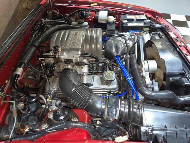Photo of 1990 Red Ford Mustang