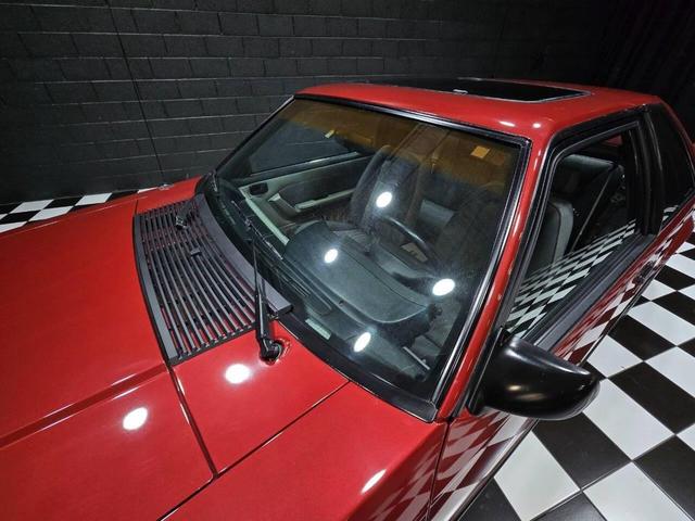 Photo of 1990 Red Ford Mustang