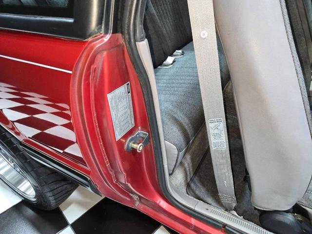 Photo of 1990 Red Ford Mustang