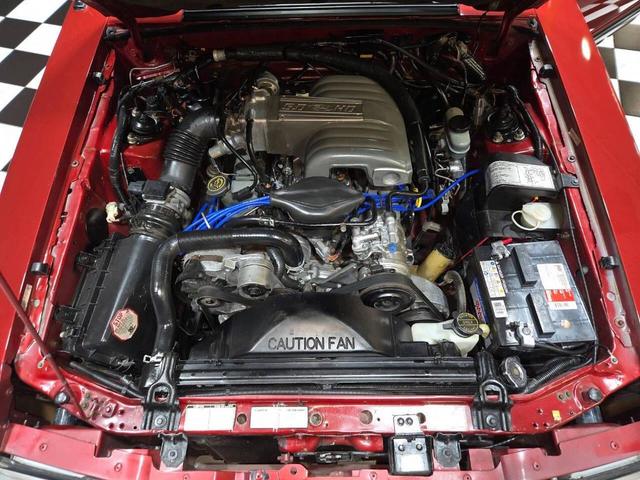 Photo of 1990 Red Ford Mustang