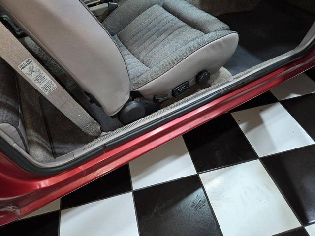 Photo of 1990 Red Ford Mustang