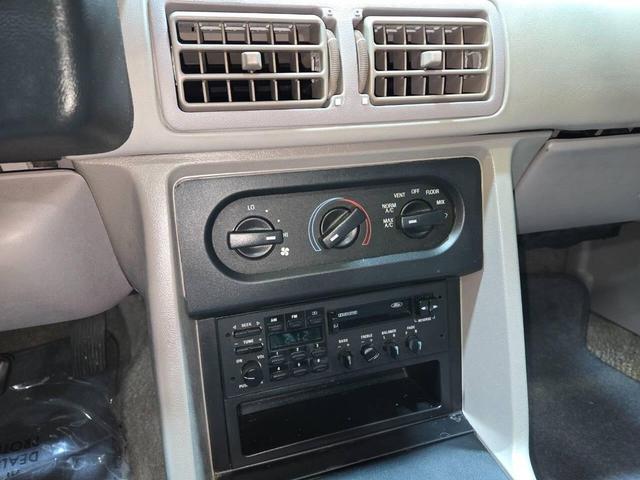 Photo of 1990 Red Ford Mustang