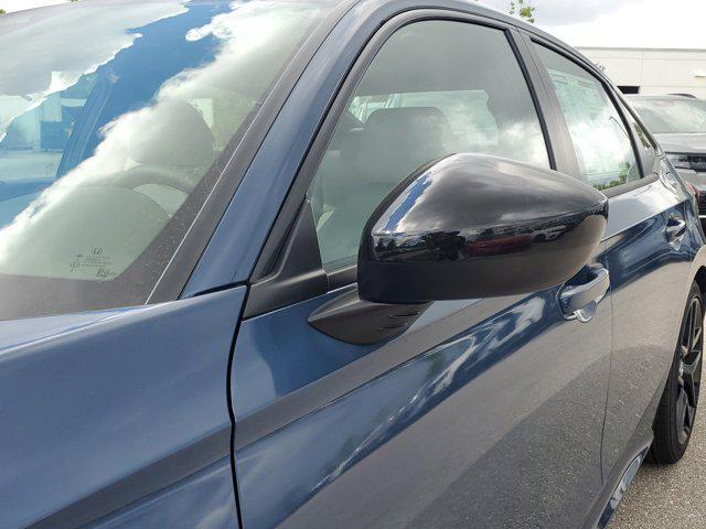 Photo of 2025 Boost Blue Pearl Honda Civic Hybrid