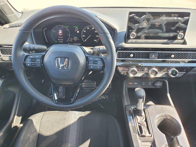 Photo of 2025 Boost Blue Pearl Honda Civic Hybrid