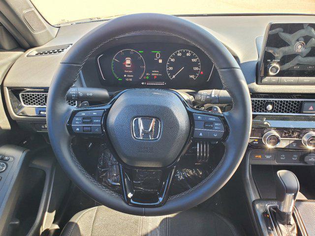 Photo of 2025 Boost Blue Pearl Honda Civic Hybrid