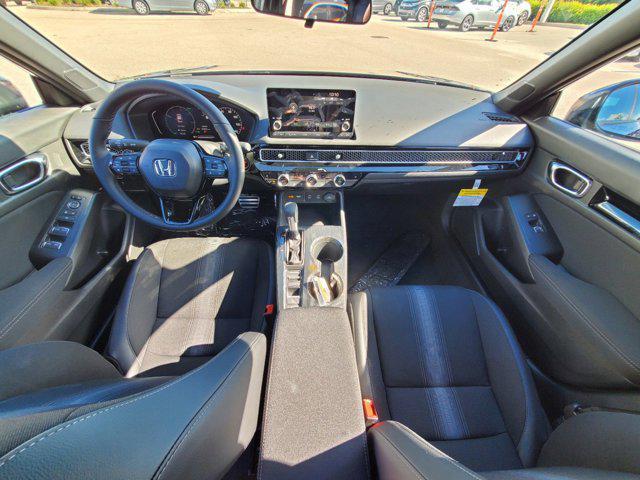 Photo of 2025 Boost Blue Pearl Honda Civic Hybrid