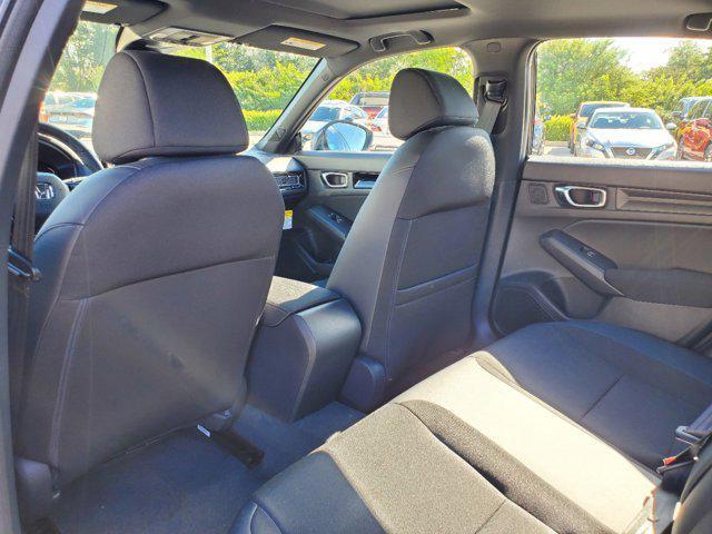 Photo of 2025 Boost Blue Pearl Honda Civic Hybrid