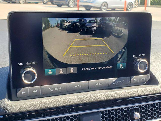 Photo of 2025 Boost Blue Pearl Honda Civic Hybrid