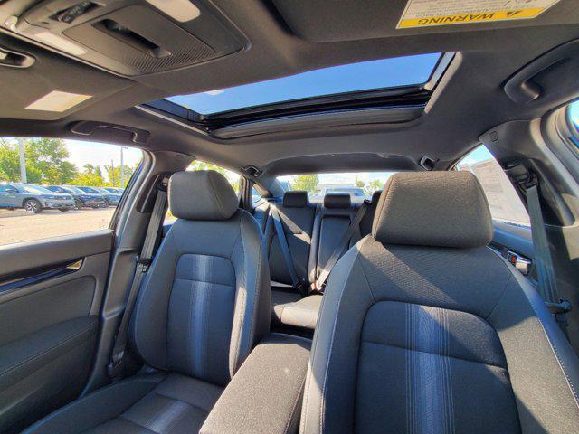 Photo of 2025 Boost Blue Pearl Honda Civic Hybrid