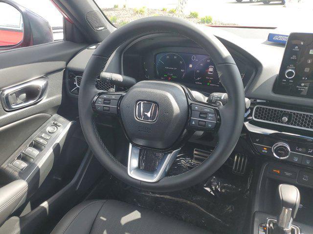 Photo of 2025 Boost Blue Pearl Honda Civic Hybrid