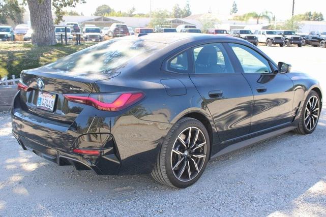 Photo of 2025 Black Sapphire Metallic BMW i4 Gran Coupe