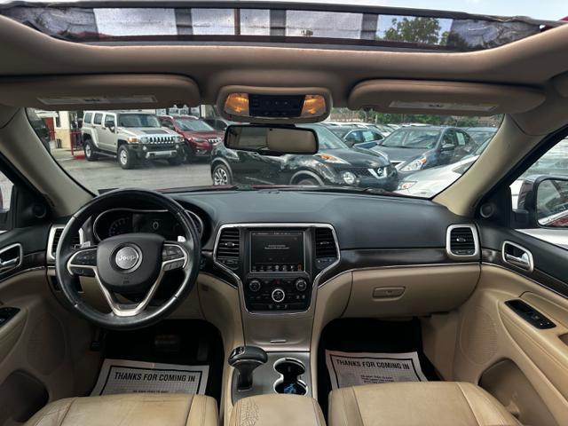 Photo of 2014 Deep Cherry Red Crystal Pearlcoat Jeep Grand Cherokee