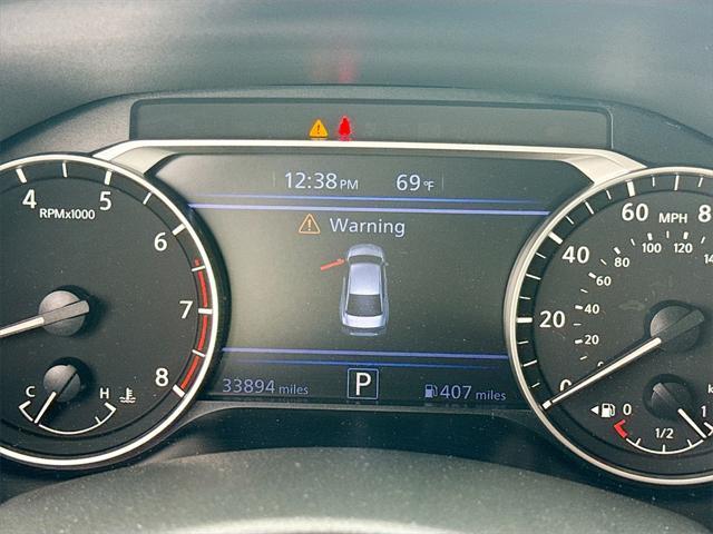 Photo of 2024 Pearl White Tricoat Nissan Altima