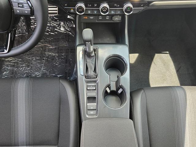 Photo of 2025 Boost Blue Pearl Honda Civic Hybrid