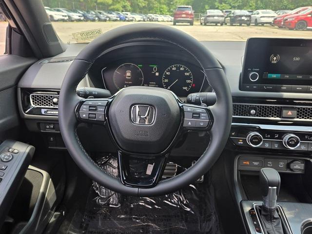 Photo of 2025 Boost Blue Pearl Honda Civic Hybrid