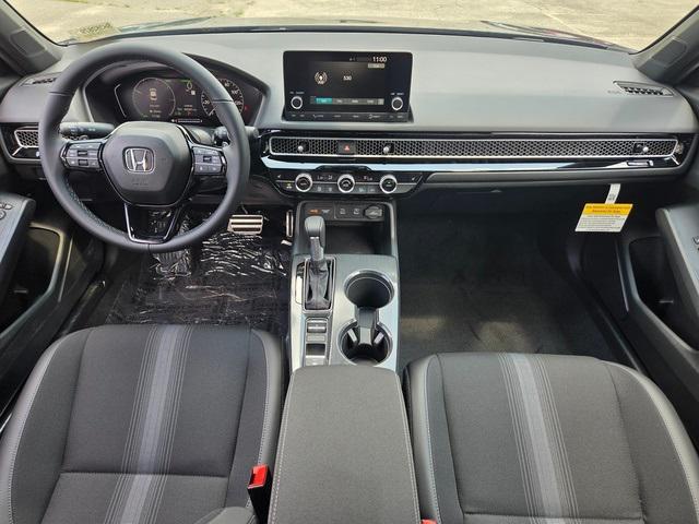 Photo of 2025 Boost Blue Pearl Honda Civic Hybrid