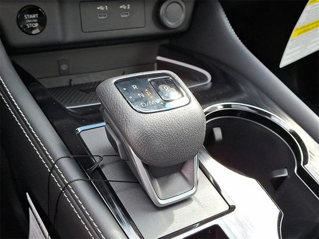 Photo of 2026 Champagne Silver Metallic/Super Black Nissan Rogue