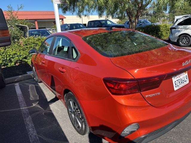 Photo of 2022 Fire Orange Kia Forte